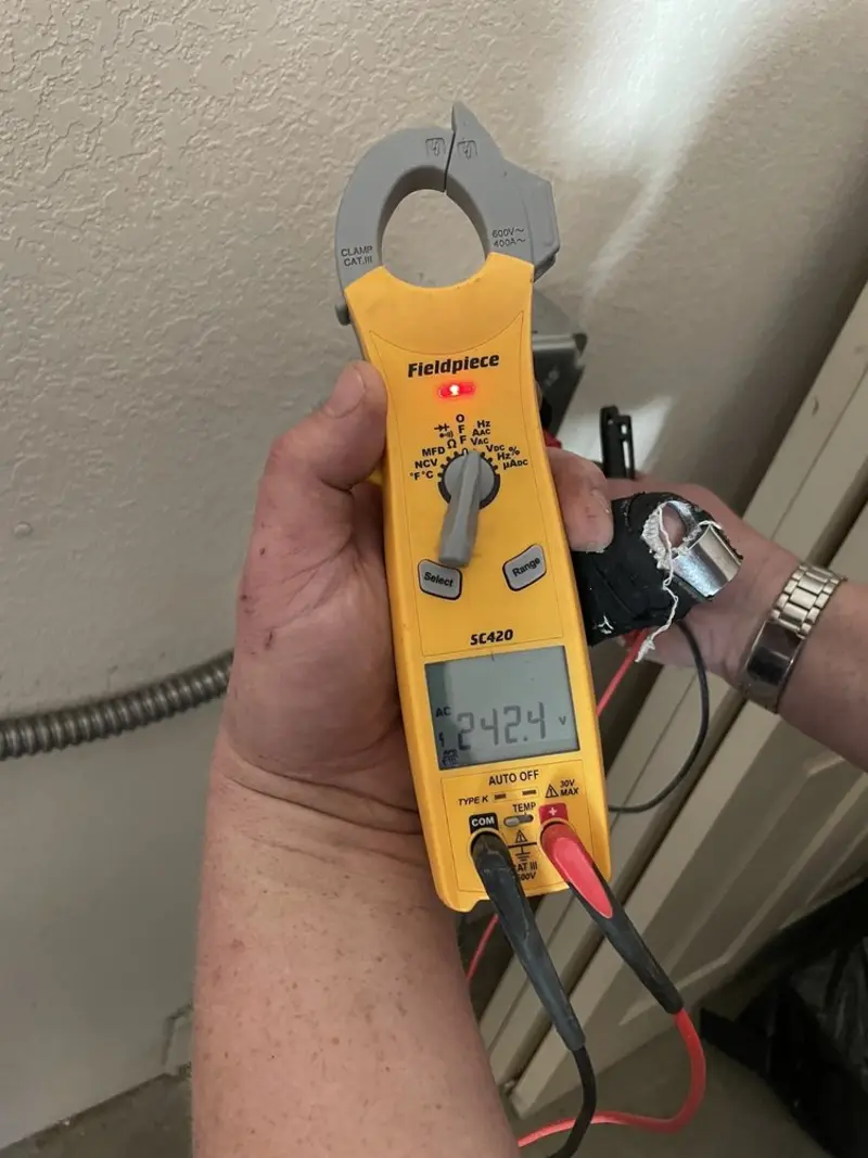 Voltage testing with clamp meter during Generator Installation in Satellite Beach